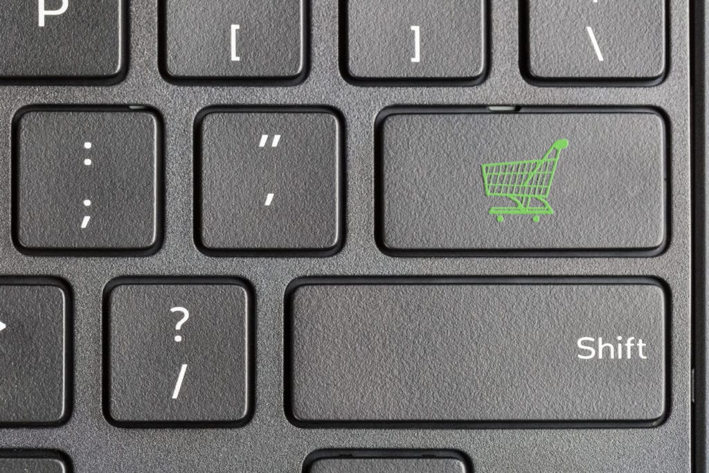 Online shopping cart icon on keyboard