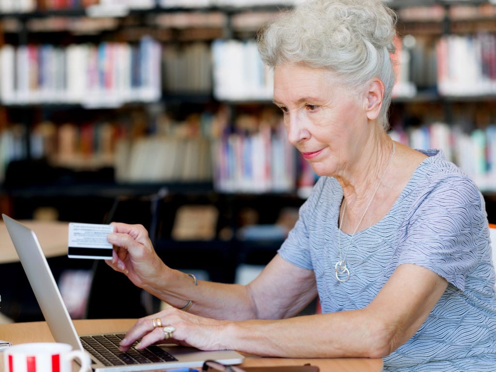 Mature lady making an online purchase