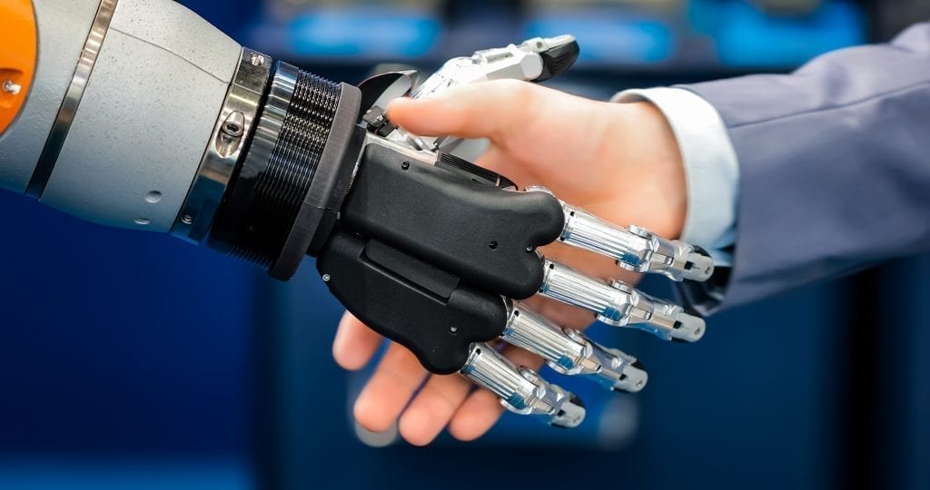 Robot shaking hands with human